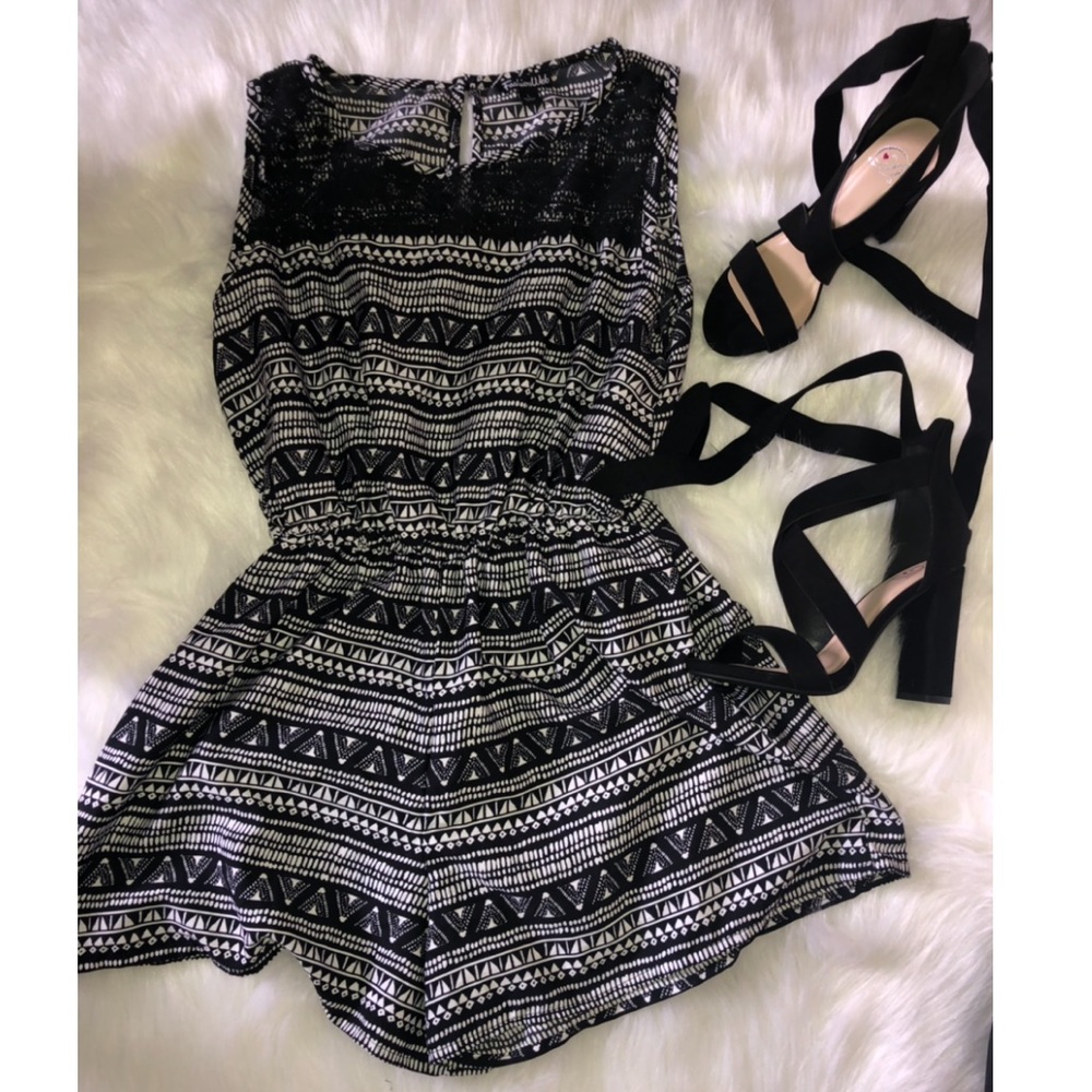 Black romper with mesh on the front top 🖤